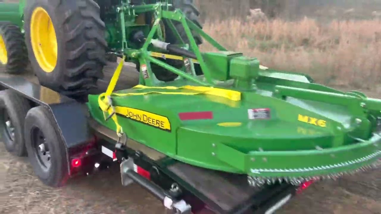 2022 John Deer 4044 M first use on clients 20 acres, bush hogging and land clearing