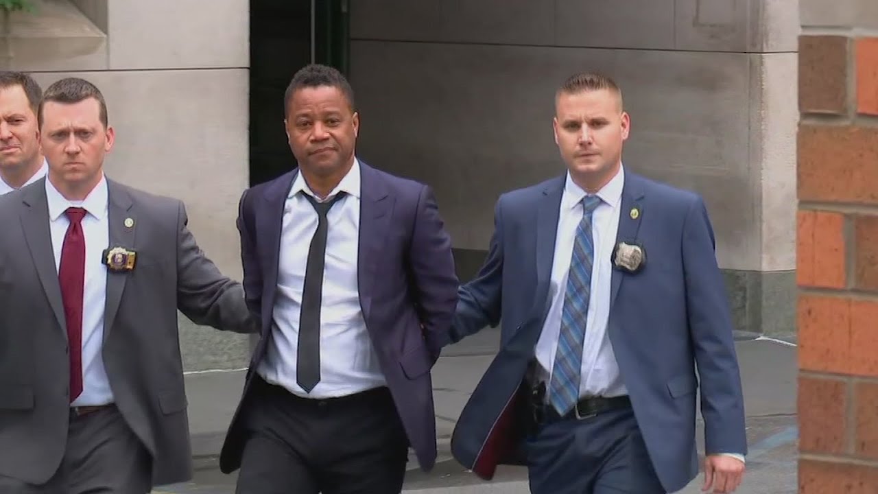 Actor Cuba Gooding Jr. led by police in handcuffs