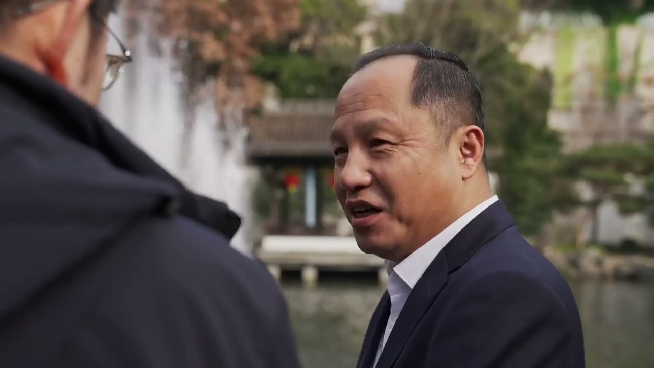 Why did UN officials come to Quzhou?
