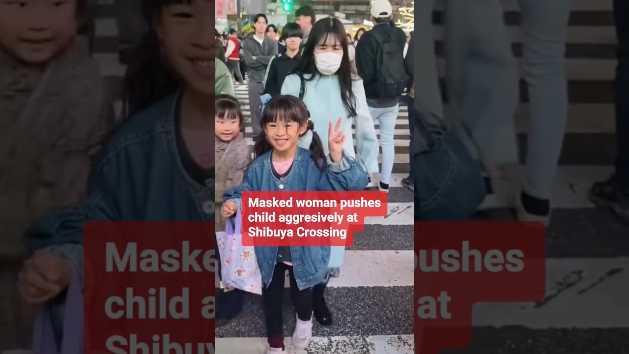 Masked woman pushes child aggressively at Shibuya Crossing