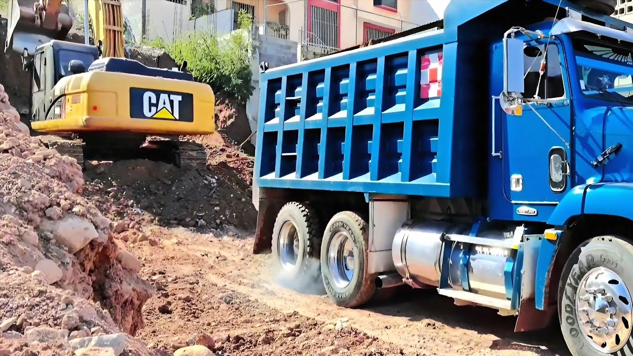 CAT 330D2L Excavator Loads Dump Trucks