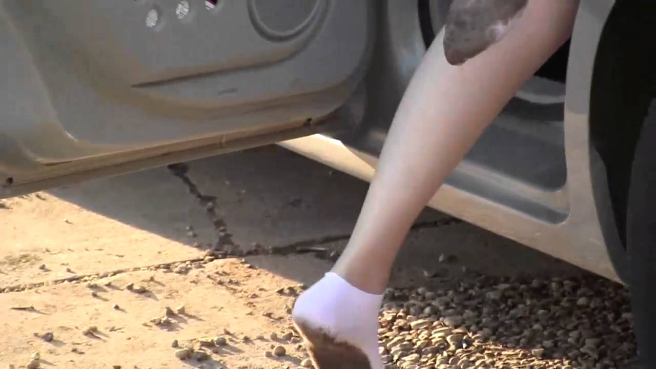 White Socks Walking in Mud Candid