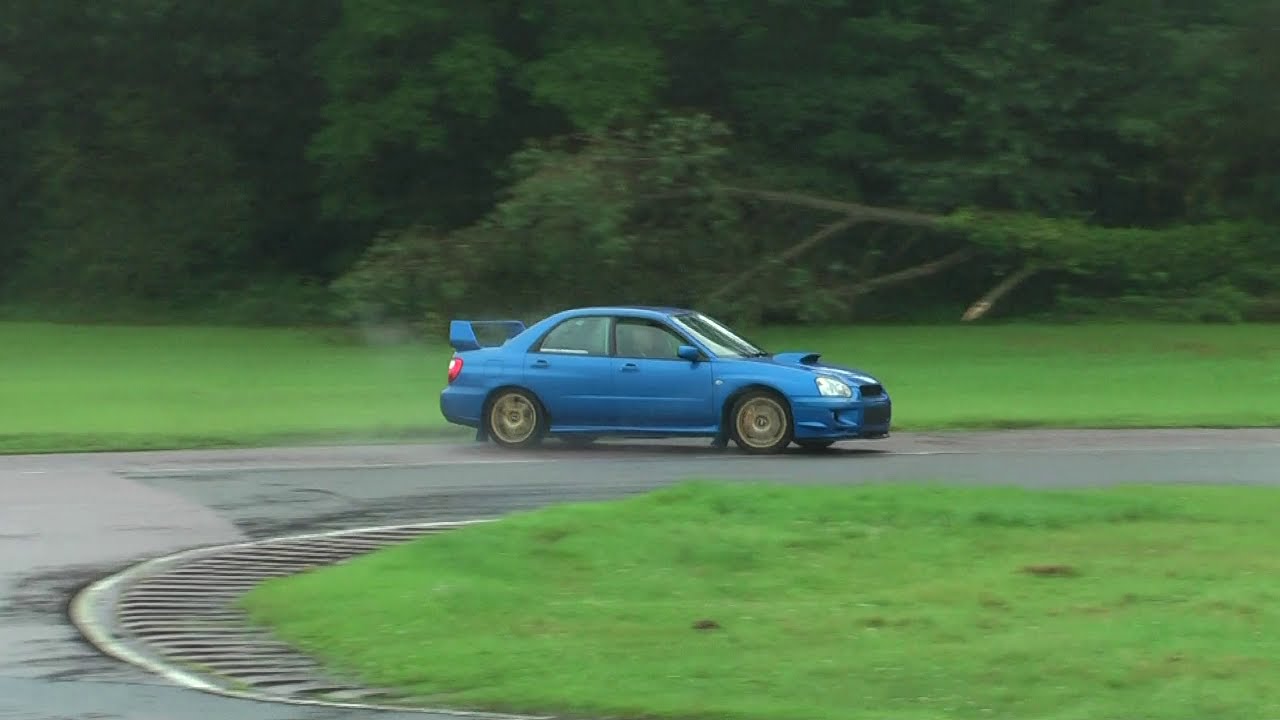 Subaru Impreza WRX STi with Blitz Nur Spec R exhaust power sliding drifting @ wet Curborough track