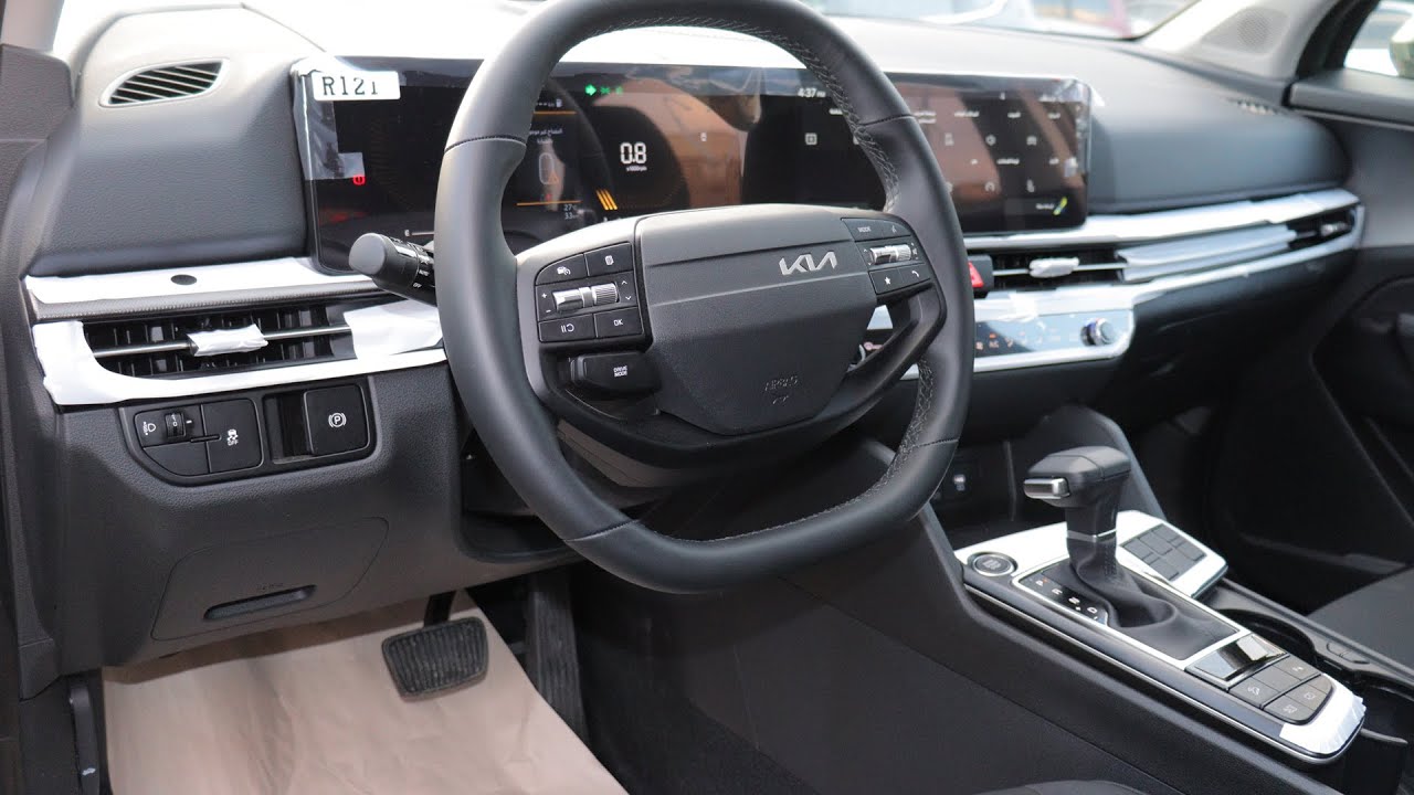 Kia Sportage 2026 EX, цвет Experience Green, обзор интерьера.