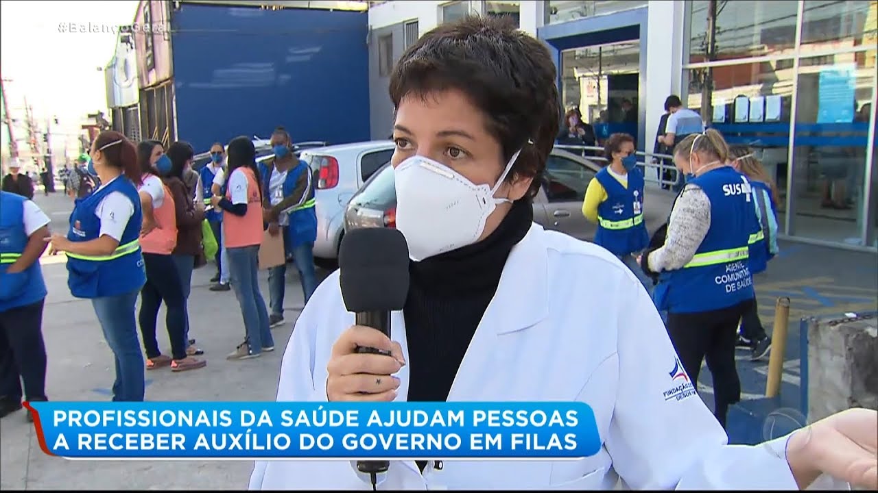 Profissionais da saúde ajudam beneficiários do auxílio emergencial em filas de banco