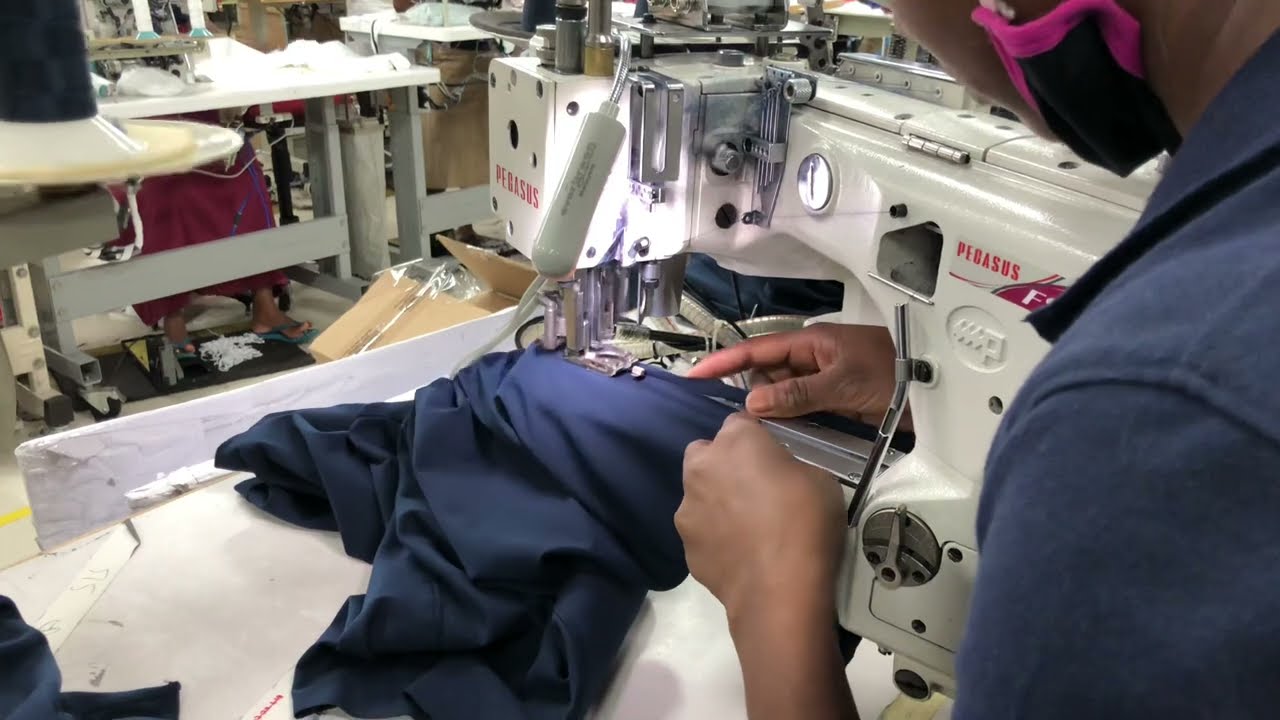 Highly skilled sewing machine operating professionals - Flat seam machine - sewing an inseam