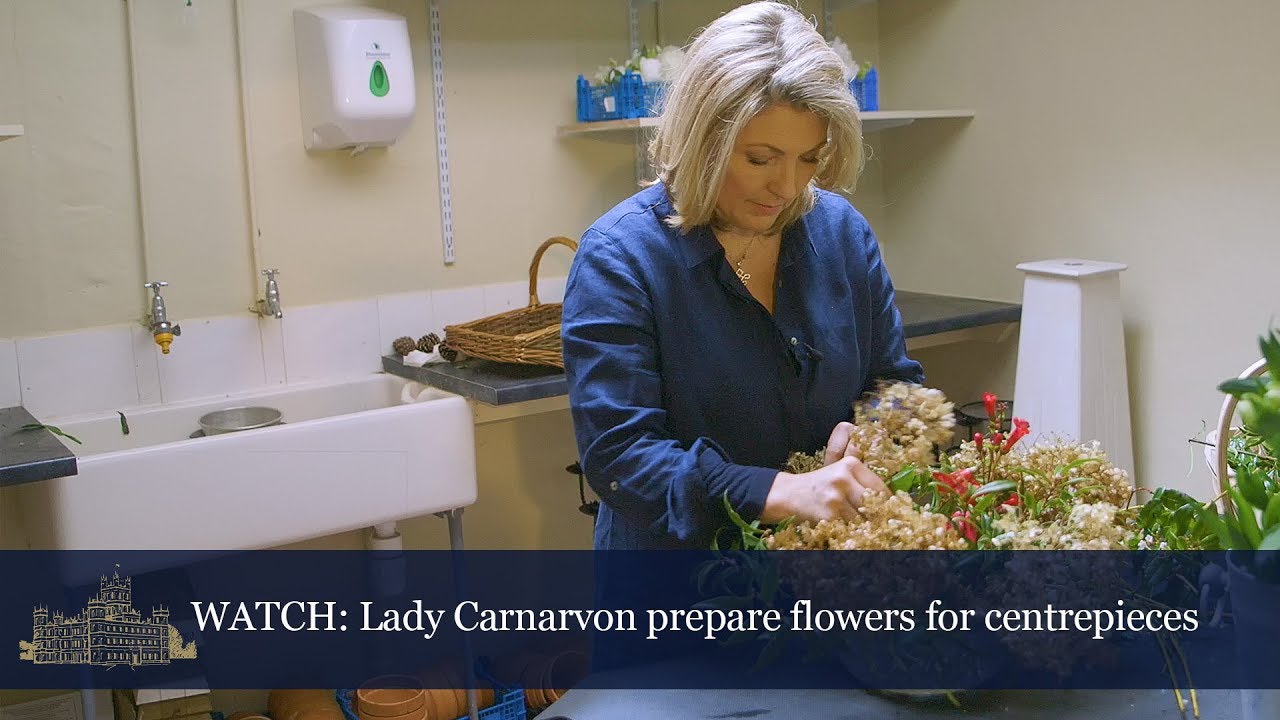 Lady Carnarvon prepares centrepieces for a dinner party