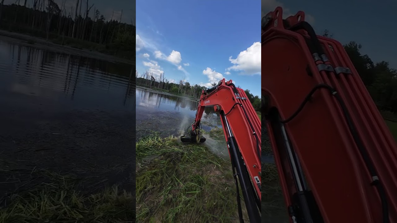 Full video mowing cattails on a pond levee with Kubota kx040 excavator and vmc exg42 brush cutter