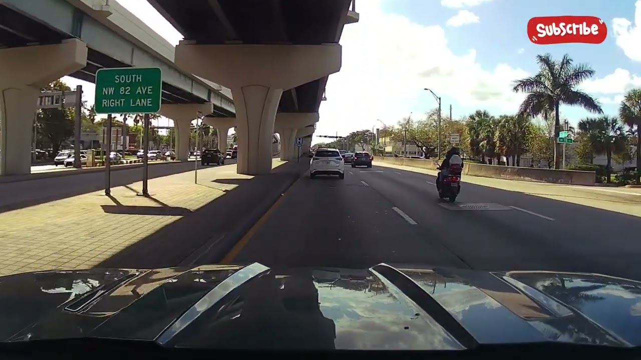 Driving in Miami on NW 25th Street in the area of ​​the airport cargo overpass and the Palmetto 826.