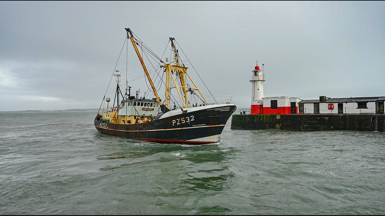 Two Beam Trawler Fishing Boats Enter Newlyn Harbour In Cornwall During Storm Herminia.