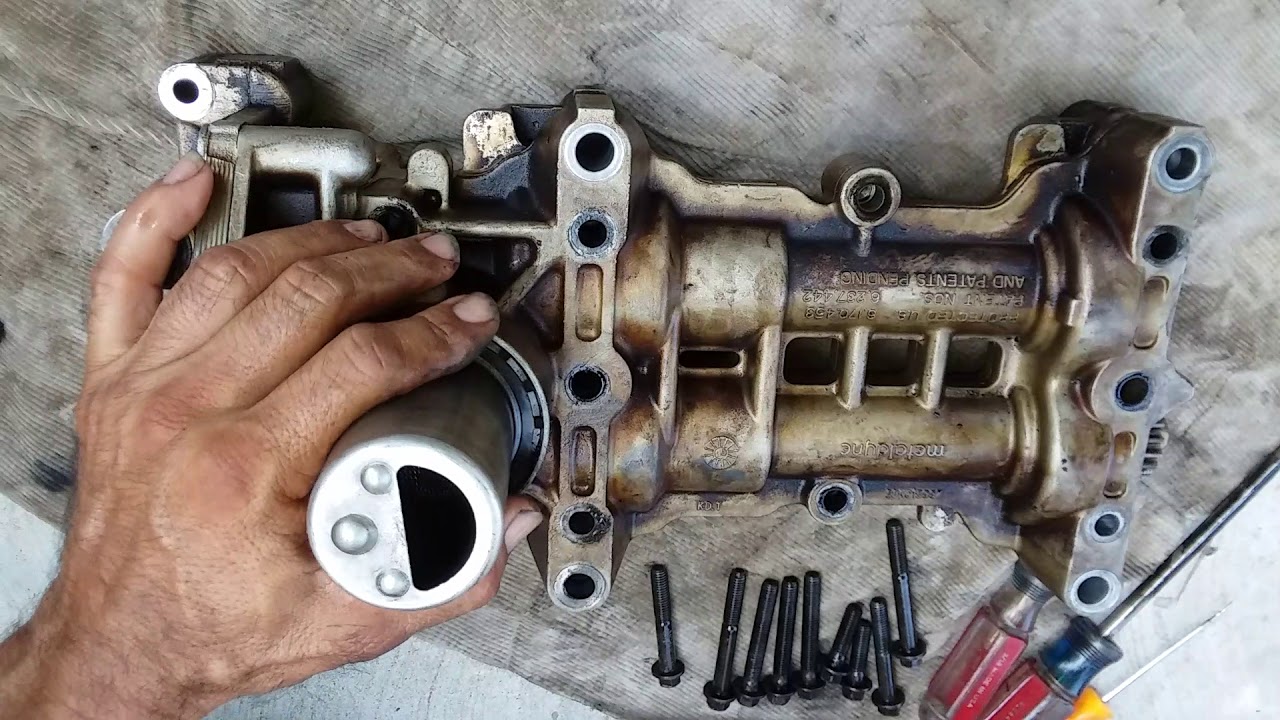 Nissan frontier 2006 motor  2.5  rebisar bomba de aceite