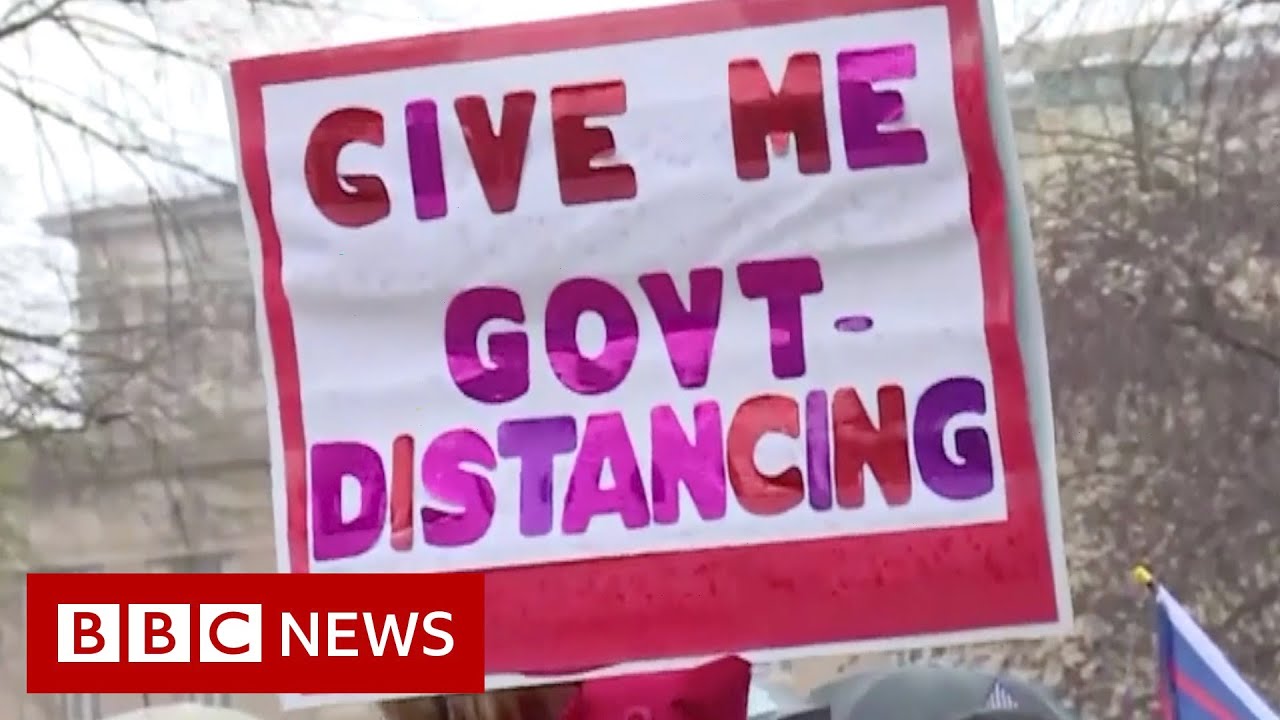 Coronavirus: Armed protesters enter Michigan statehouse - BBC News
