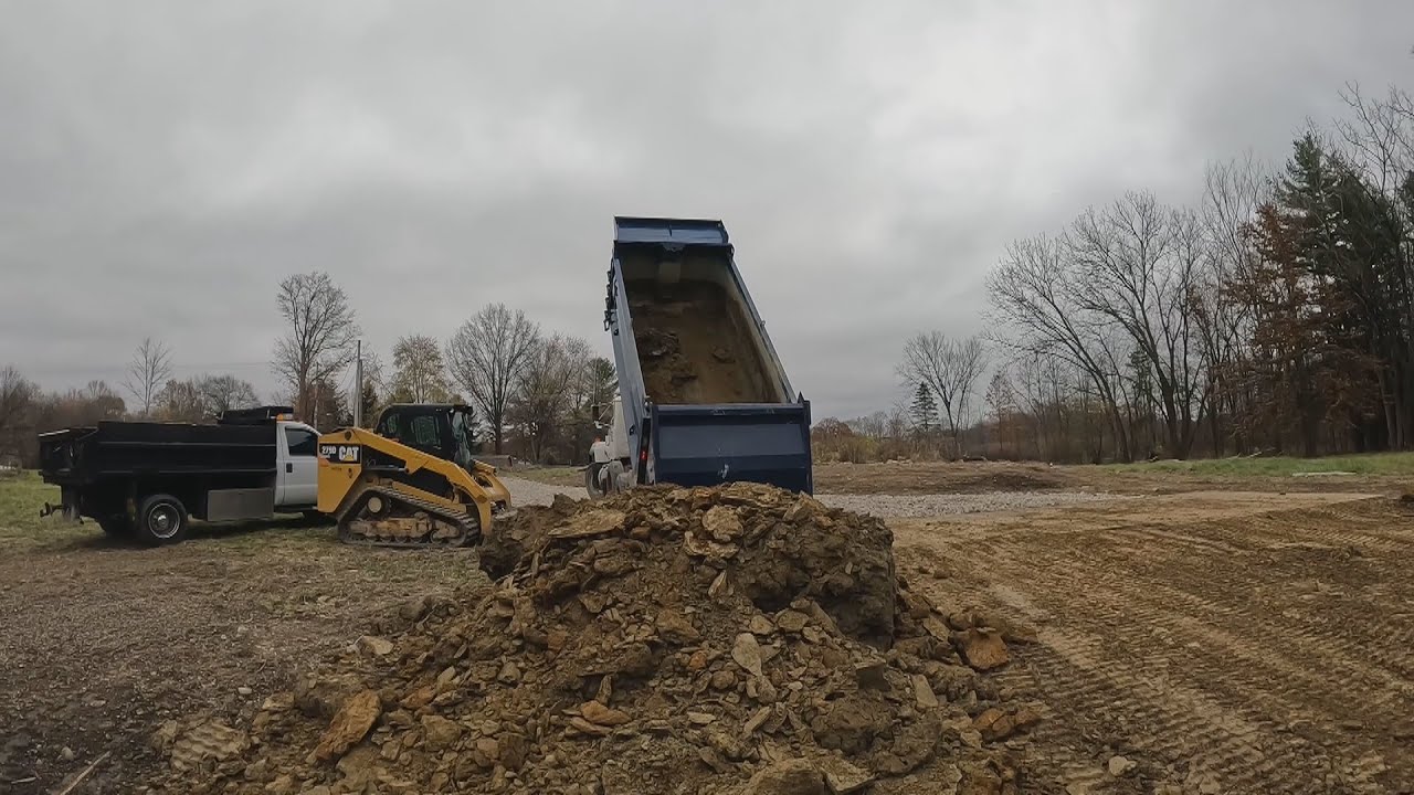 Pushing dirt with my CAT 279D skid steer