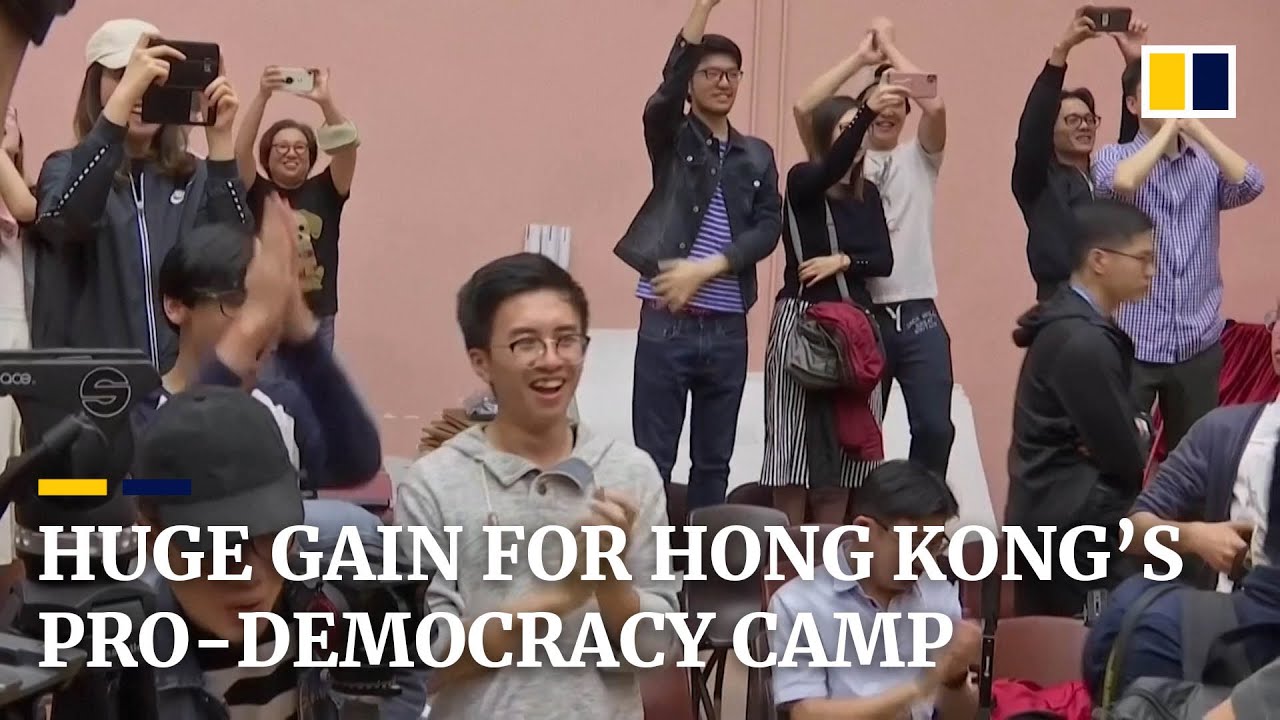 Hong Kong votes overwhelmingly for pro-democracy camp with record turnout in local elections