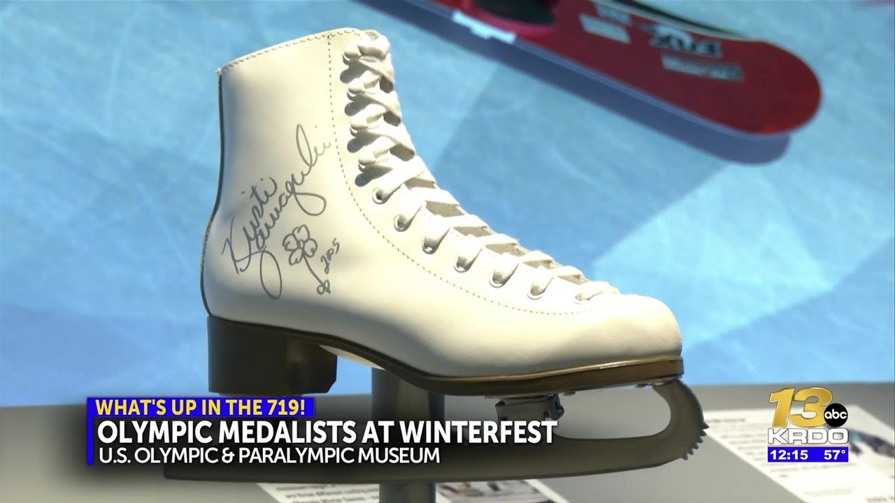 Two olympic medalists signing autographs at free 'Winter Fest' on Saturday