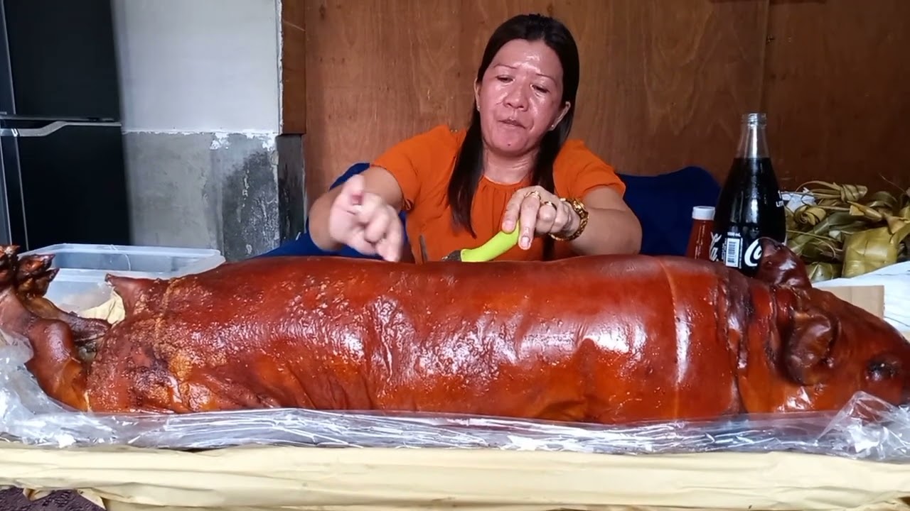 EATING LETCHON BABOY