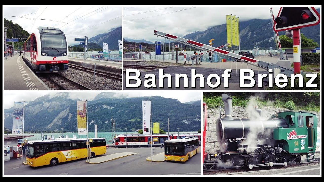 Bahnübergang, Postautos, Zahnrad und Schmalspurbahn beim Bahnhof Brienz, Kanton Bern, Schweiz 2022