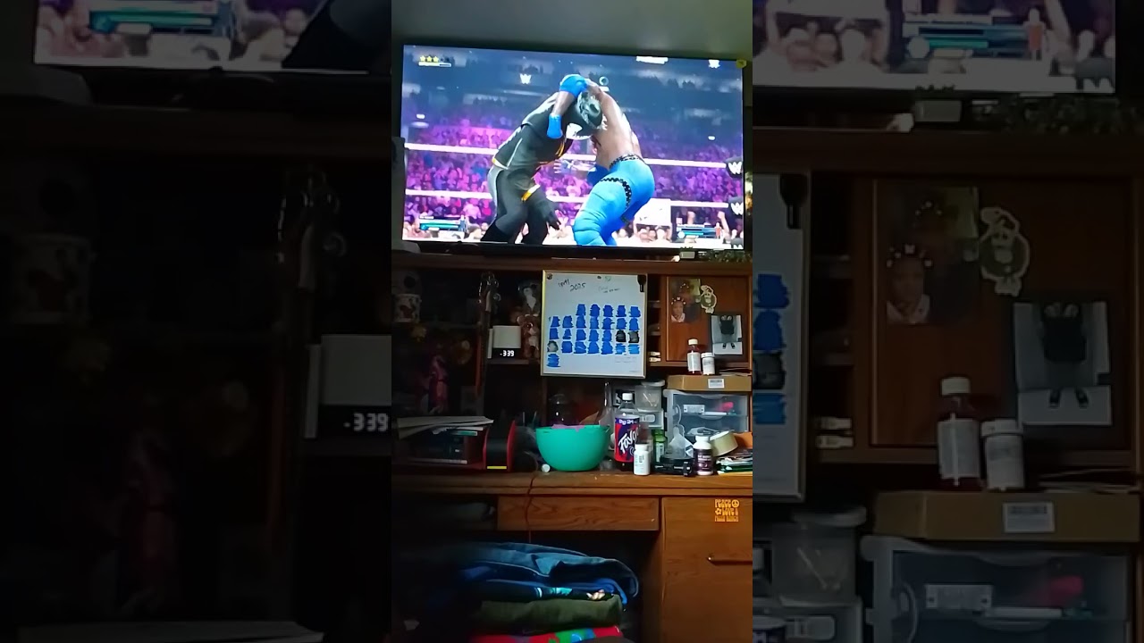 Father and son playing WWE 2k24