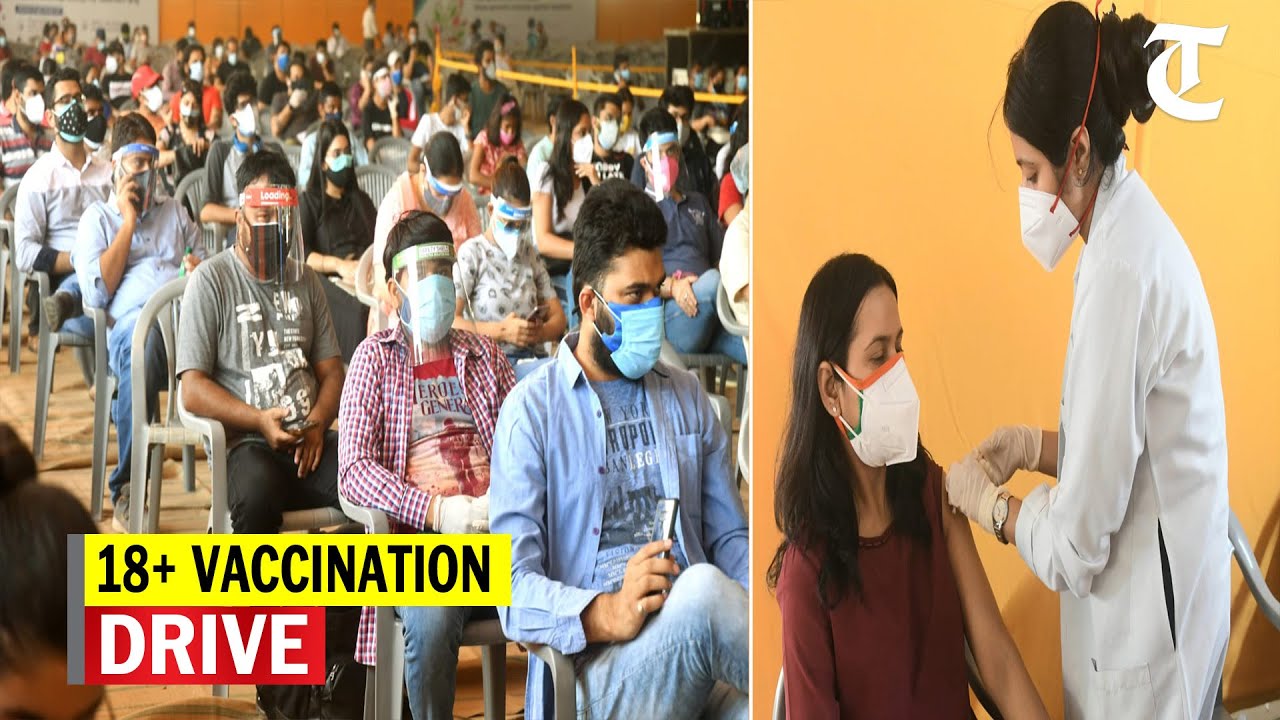 People in 18+ age group line up outside vaccination centers in Delhi and Punjab as covid cases surge