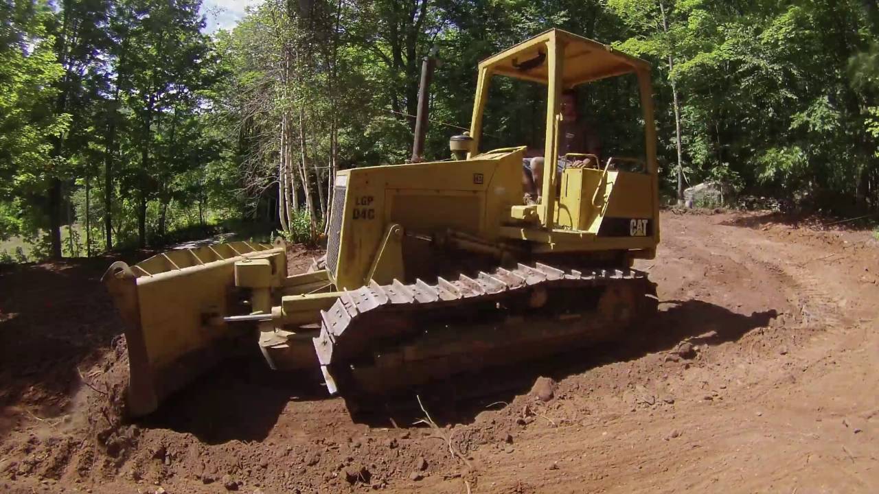 cat d4c dozer pushing dirt