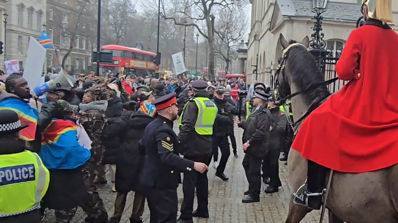 PROTESTERS STORM HORSE GUARDS CORPORAL ORDERS EMEGENCY LOCK DOWN AS PROTESTERS HEAD FOR THE GATE