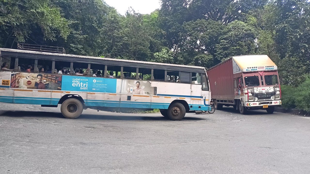 Heavy container truck and ksrtc bus Turning Seventh Hairpin bend Thamarassery Ghat Kerala india 