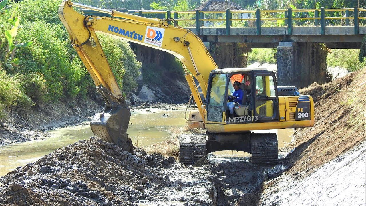 Digger Excavator Clearing The River Bank Komatsu PC200
