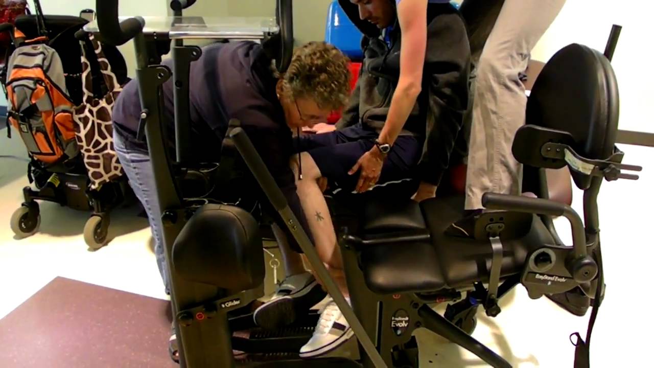 Quadriplegic getting transferred into stander