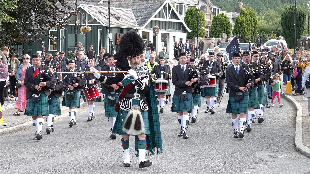 Newtonhill Pipe Band playing Flett from Flotta on the march to 2023 Braemar Gathering in Scotland