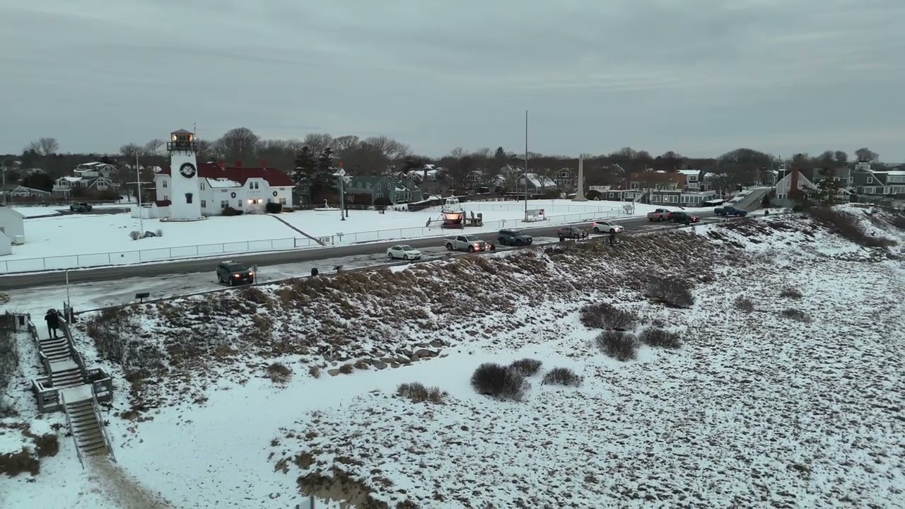 Chatham, Cape Cod Lighthouse Aerial with Snow in Winter Storm, stock footage 