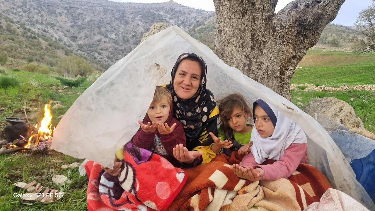 A homeless mother, her roof is the rain, her shelter is the embrace of her children.