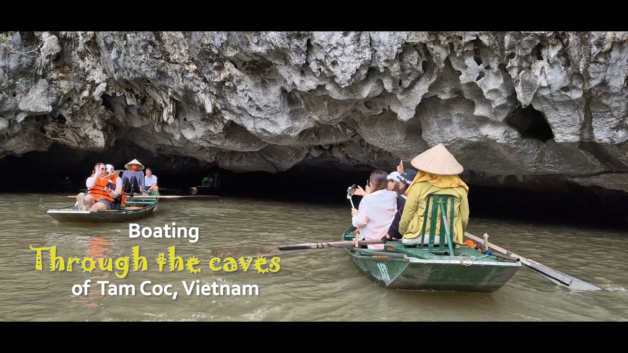 Boating through the caves of Tam Coc in Vietnam