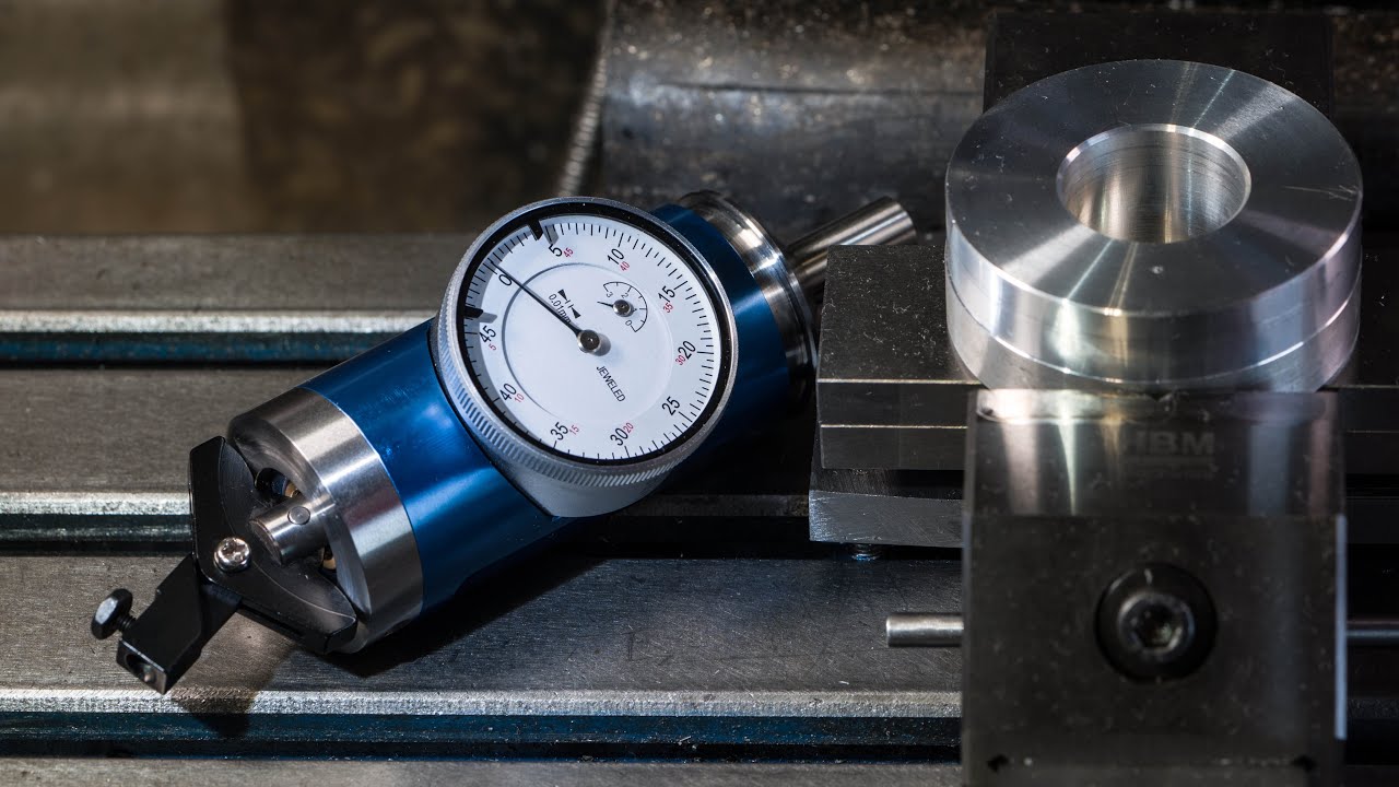 Reloj coaxial o Buscador de centros