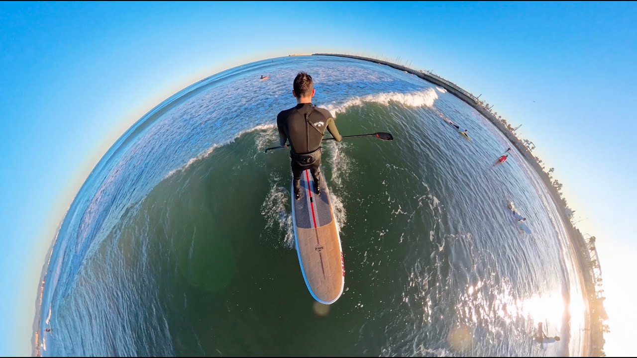 SUP surfing longboard in the Valencian Gulf