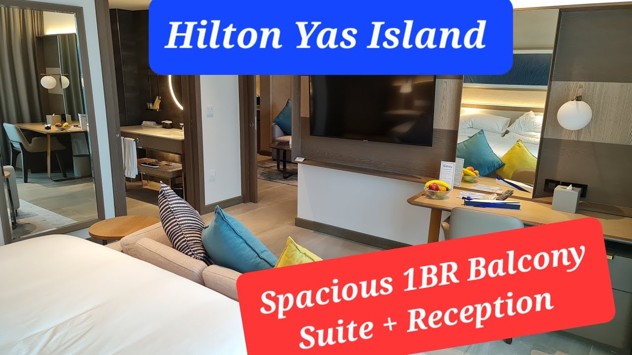Hilton Yas Island - 1 bedroom suite  - spacious balcony - reception room with large TV @palmsail