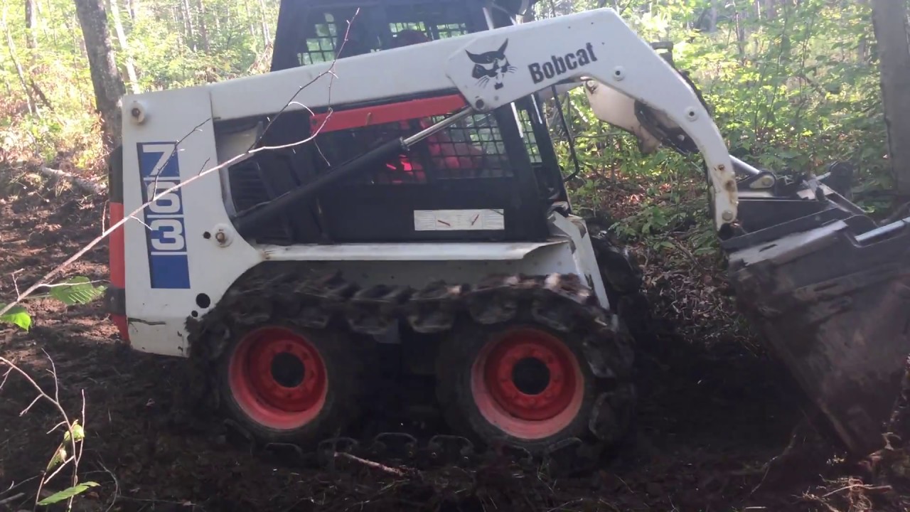 763 bobcat with grouser tracks grading atv trails