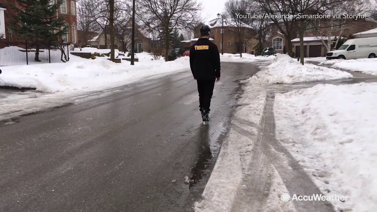 Man attempts to skate on frozen Toronto street
