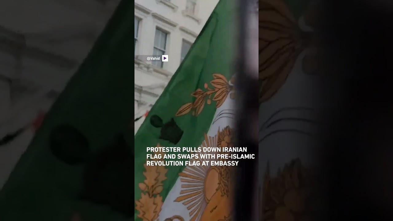 Protester pulls down national flag from Iranian embassy in London