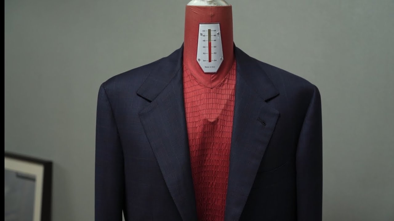 Creating a bespoke suit jacket made from Zegna Shadow Check wool fabric.