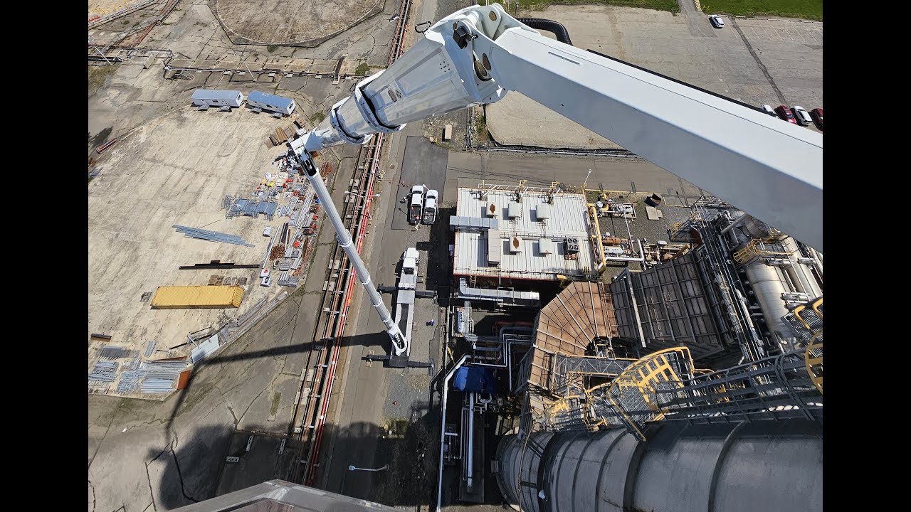 300-ft aerial lift at the power plant. Installing 6' antennas on smokestacks. Daily operated rentals