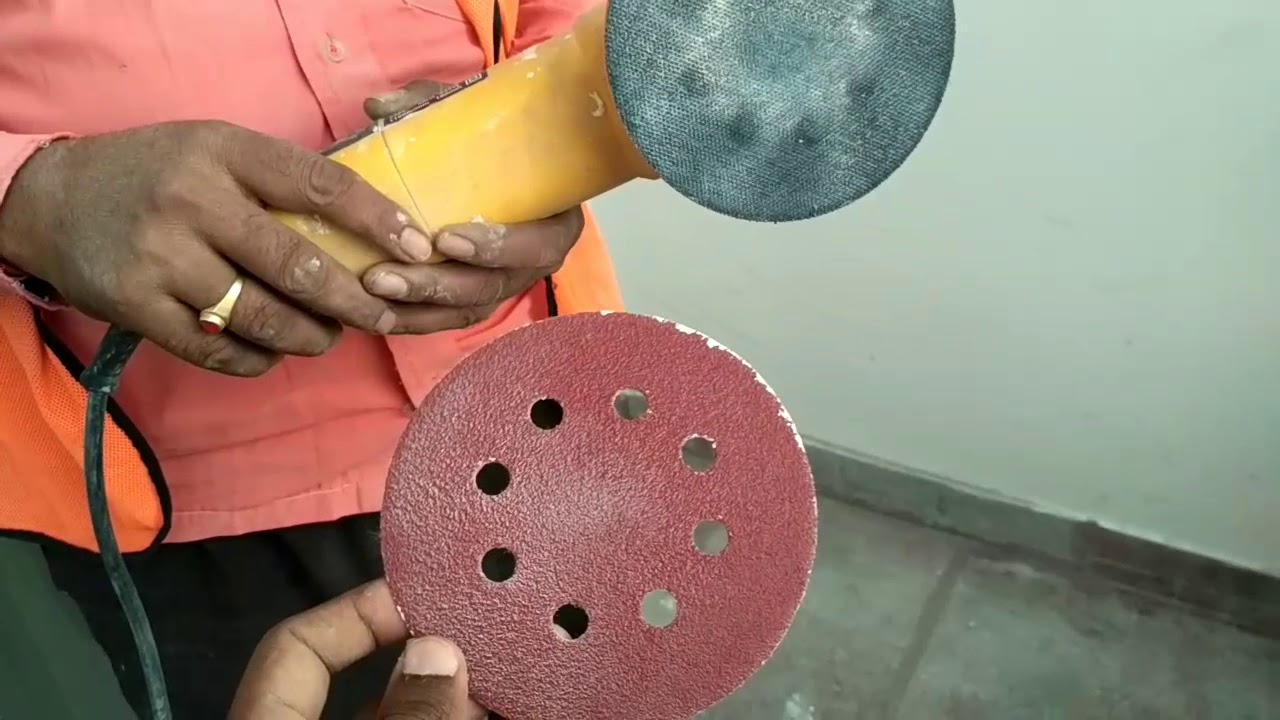 Remove cement, paint stains on tile by using grinder,  velcro disc,  sanding paper
