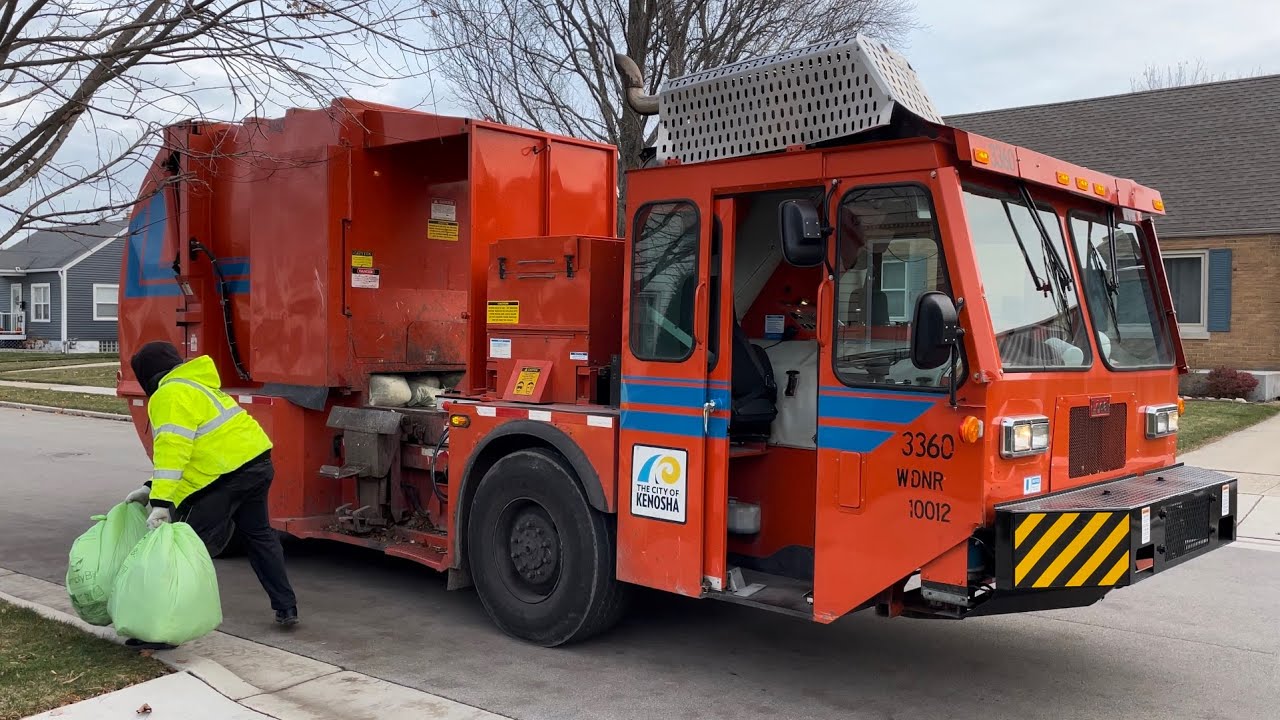 One of the Famous Kenosha Lodal Evo Garbage Trucks Packing Bags of Leaves
