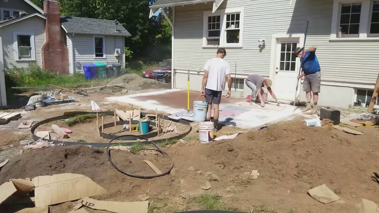 Time lapse of making a stamped concrete fire pit and patio