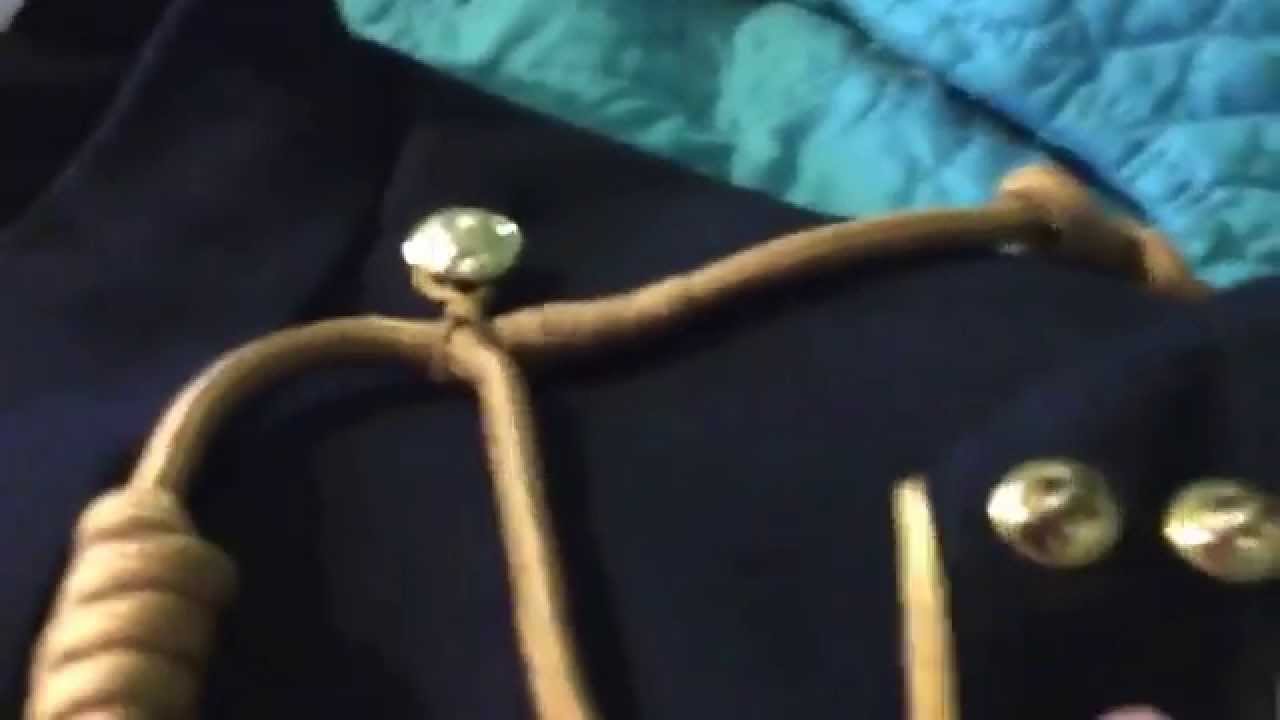 /swifty/putting a JROTC shoulder cord on