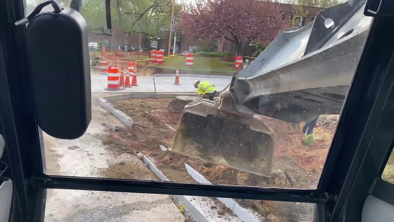 Digging for sidewalk with the GRADAll