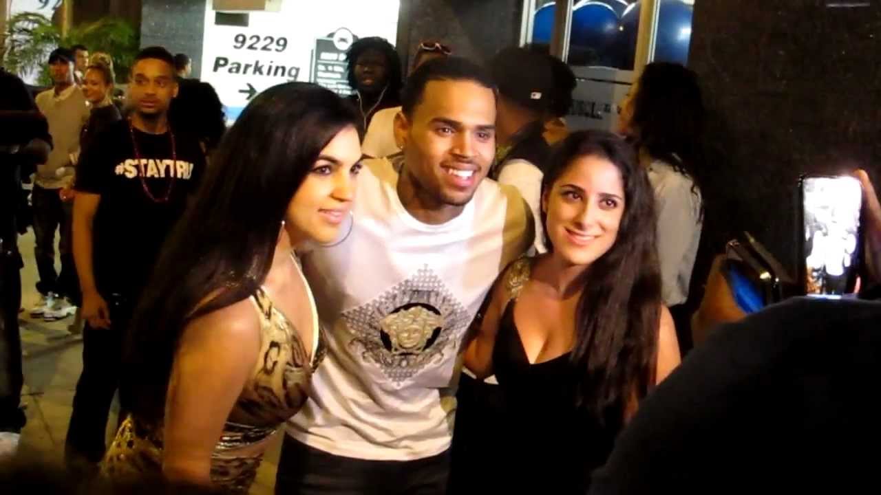 Chris Brown greets fan while arriving at Bootsy Bellows in West Hollywood, CA