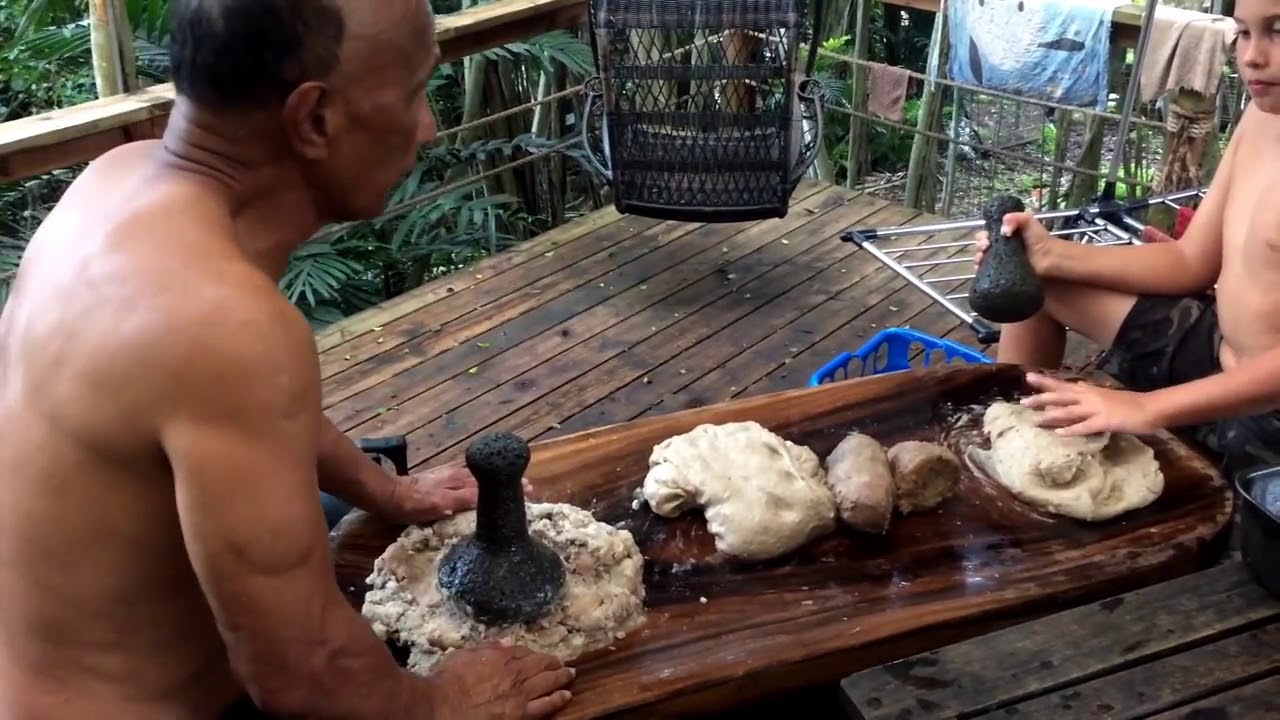 Kumu Kawaa teaches Kamuela how to pound poi