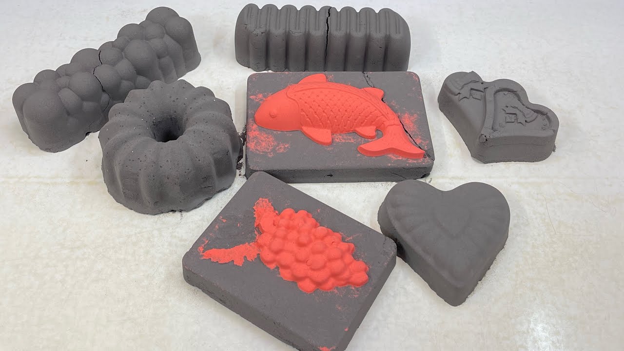 Crushing large black baking soda shapes with big red fish
