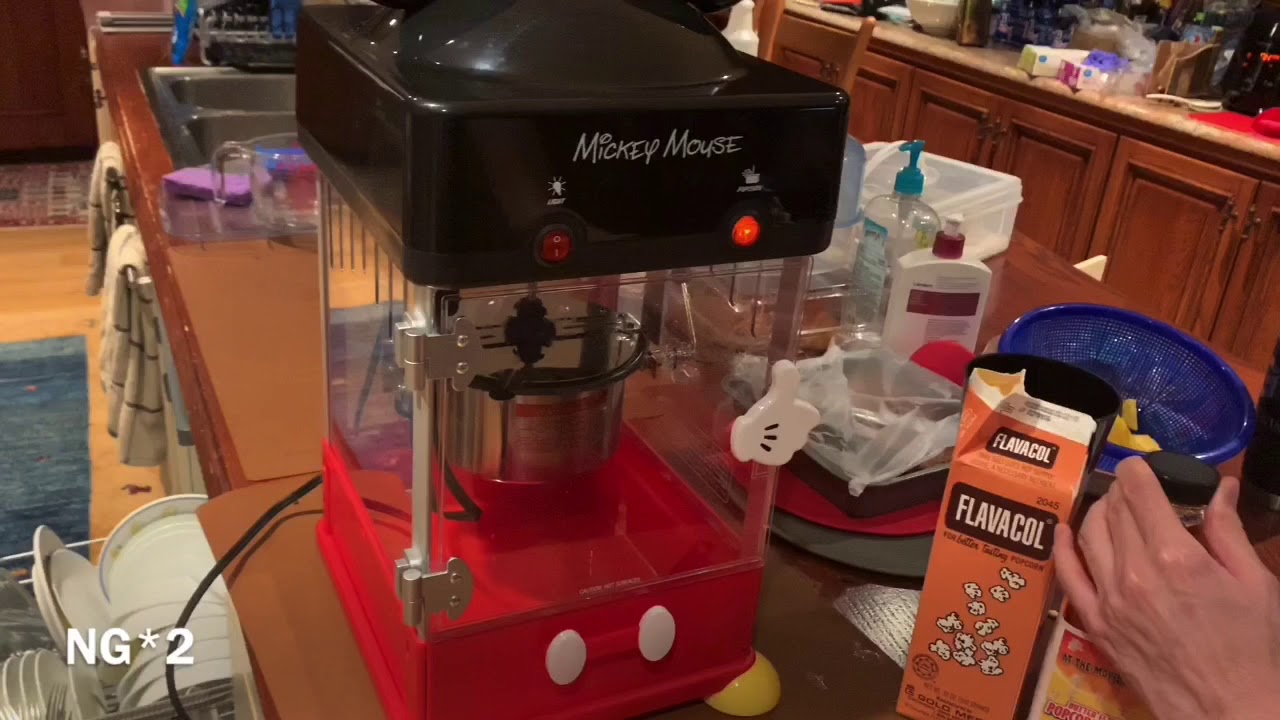 Homemade popcorn via cute mickey mouse popcorn machine