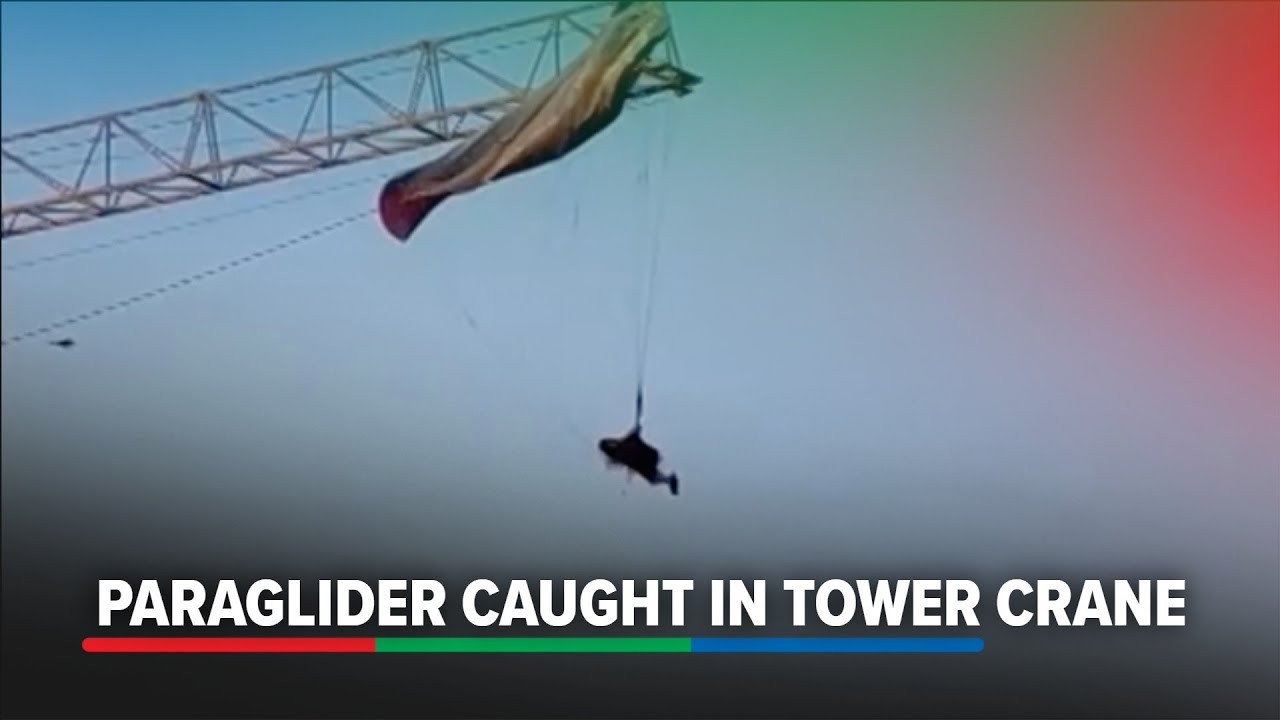 Paraglider left dangling after getting caught in tower crane in China's Sichuan | ABS-CBN News